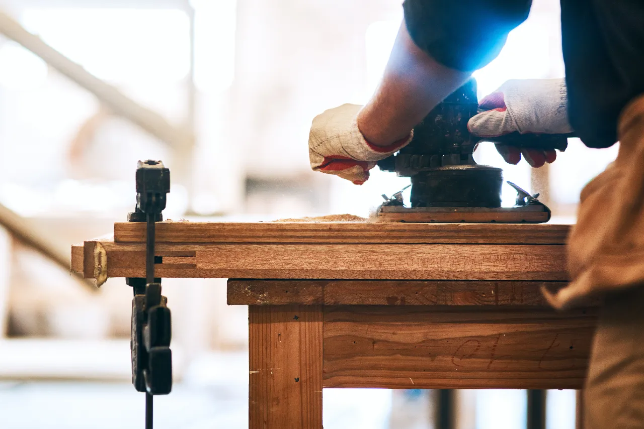 Carpenter installing wood trim in a New York home